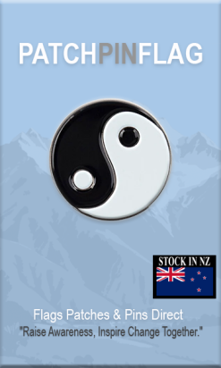 A Ying Yang lapel pin featuring a circular design with black and white halves, symbolizing balance.  Suitable for hats, ties, or lapels.