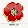 A red poppy lapel pin with intricate petal detailing, symbolizing pride. The pin can be worn on a lapel, hat, tie, or as a brooch. It represents remembrance and support, often associated with veterans.