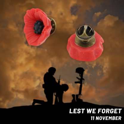 A red poppy lapel pin with intricate petal detailing, symbolizing pride. The pin can be worn on a lapel, hat, tie, or as a brooch. It represents remembrance and support, often associated with veterans.
