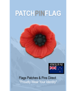 A red poppy lapel pin with intricate petal detailing, symbolizing pride. The pin can be worn on a lapel, hat, tie, or as a brooch. It represents remembrance and support, often associated with veterans.